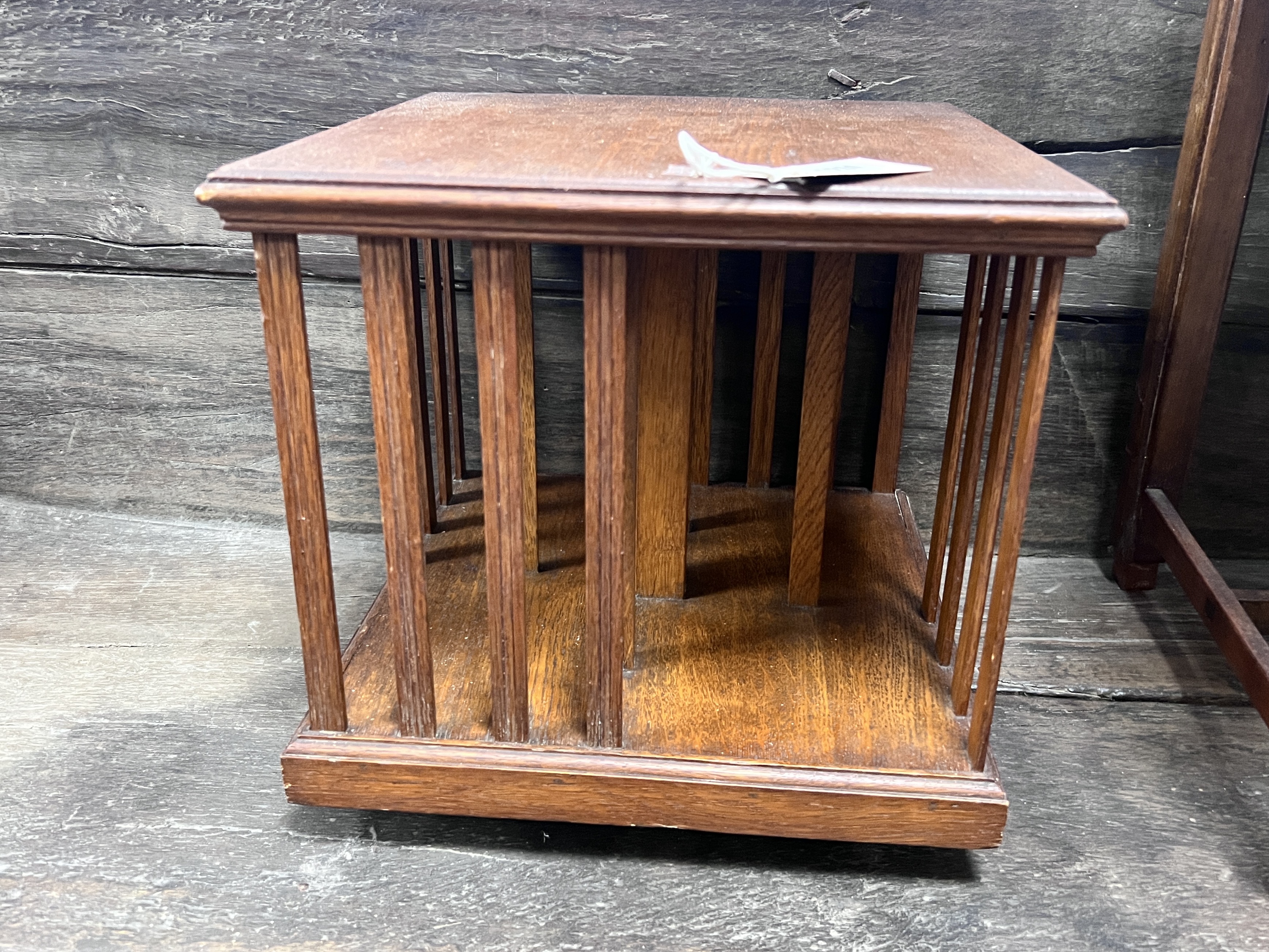 An Edwardian oak table top revolving bookcase, width 33cm, height 32cm